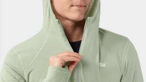 Lightweight, low-profile and infinitely comfortable in a range of conditions, Polartec® Power Grid™ fleece is the secret to this midlayer’s powerful warmth and minimal bulk. The interior’s raised grid design increases breathability and keeps volume down, holding in heat when it's needed and letting it out when it's not. It quickly wicks moisture from skin, keeping you dry and comfortable. The streamlined hood adds more options for warmth, with elastic that prevents it from slipping while on the move. Flatlock seams ensure smooth layering while thumbholes keep sleeves in place. A concealed zipper pocket on the lower hem stashes small essentials.
