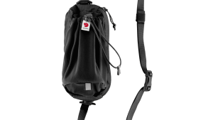 Improve the functionality of your backpack in the blink of an eye with Fjällräven’s Abisko Bottle Pocket that attaches easily to any backpack that has a webbing loop on the shoulder strap at shoulder height. The full stretch front compartment fits bottles up to 750ml and there is a zippered pocket to keep your phone or snacks close at hand. Use the detachable strap to transform the bottle pocket into a small crossbody bag or attach it to Abisko Softpack 16 as a hip strap. Made from recycled fabrics.